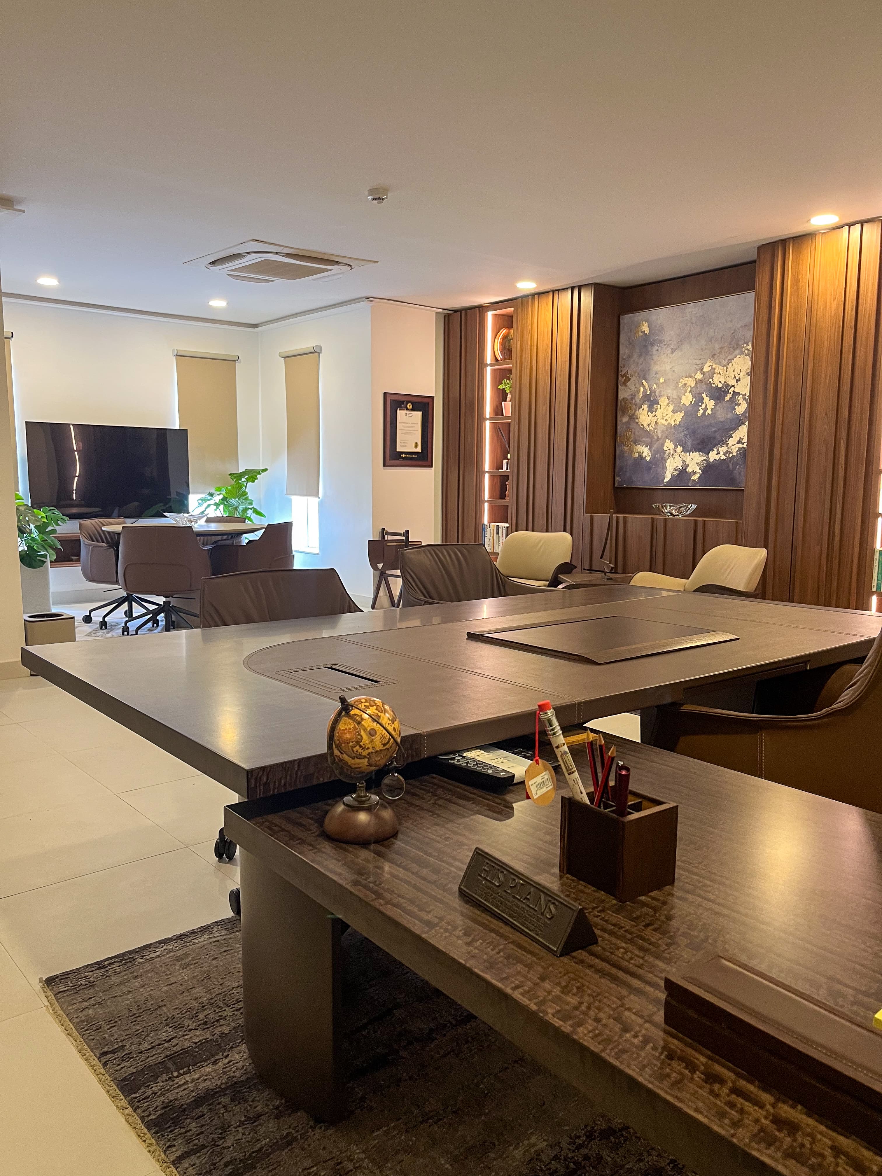 The Brook Finance open-plan workspace with neutral tones and timber accents — Lagos